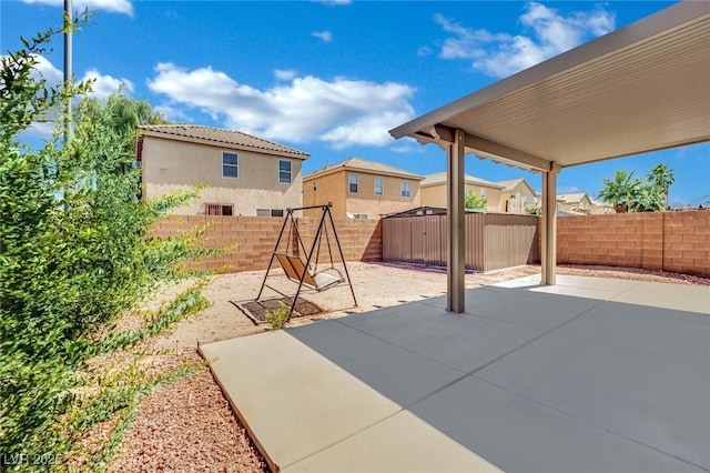 6430 Jackrabbit Run Ave, Las Vegas, NV 89122 - fenced backyard with a patio area and a shed