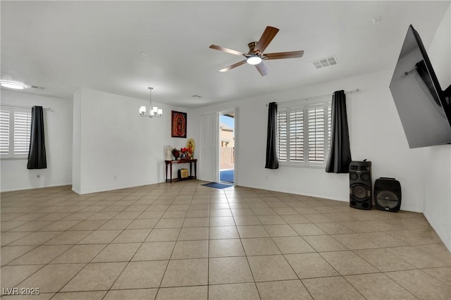 6430 Jackrabbit Run Ave, Las Vegas, NV 89122 - unfurnished living room with a chandelier, a ceiling fan, and light tile patterned floors