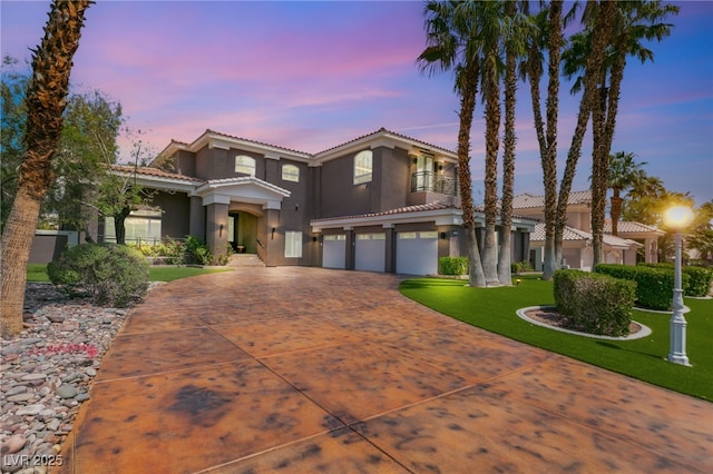 7520 Captains Harbor Dr, Las Vegas, NV 89117 - mediterranean / spanish house with a tiled roof, stucco siding, concrete driveway, and a garage