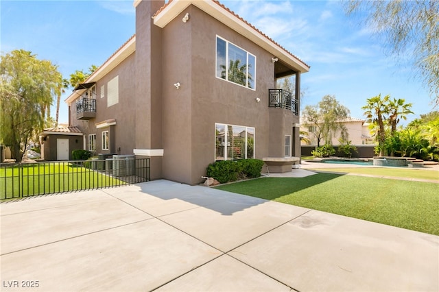 7520 Captains Harbor Dr, Las Vegas, NV 89117 - view of home's exterior with stucco siding, a balcony, a patio area, and a tile roof