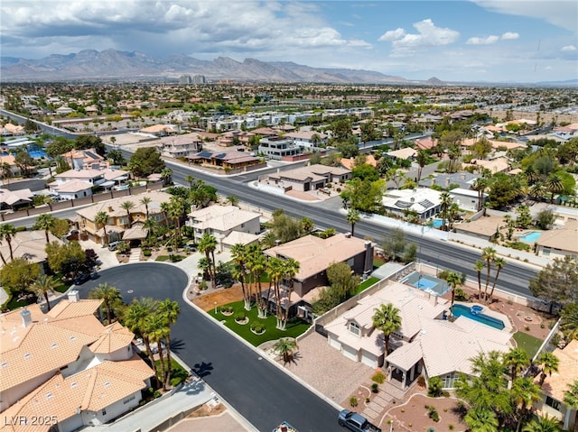 7520 Captains Harbor Dr, Las Vegas, NV 89117 - aerial view of residential area featuring a mountainous background and a pool area