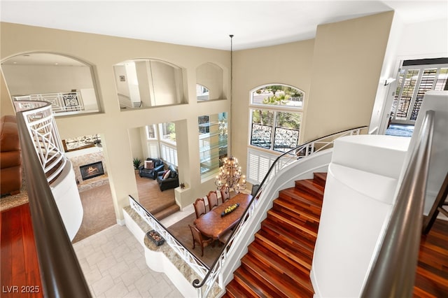 7520 Captains Harbor Dr, Las Vegas, NV 89117 - stairs featuring plenty of natural light and a fireplace