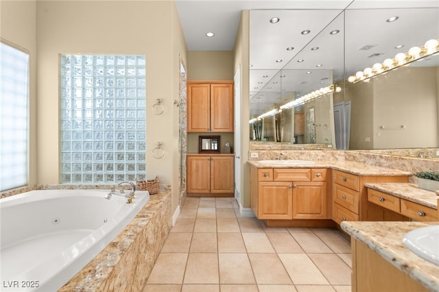 7520 Captains Harbor Dr, Las Vegas, NV 89117 - bathroom with a whirlpool tub, vanity, tile patterned floors, plenty of natural light, and recessed lighting