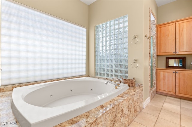 7520 Captains Harbor Dr, Las Vegas, NV 89117 - bathroom with a tub with jets, tile patterned flooring, and plenty of natural light