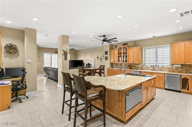 7520 Captains Harbor Dr, Las Vegas, NV 89117 - kitchen featuring dishwasher, a warming drawer, backsplash, an island with sink, and recessed lighting