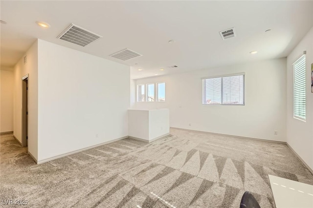1289 Valencia Cliffs Ave, Henderson, NV 89012 - spare room with light carpet, plenty of natural light, and recessed lighting