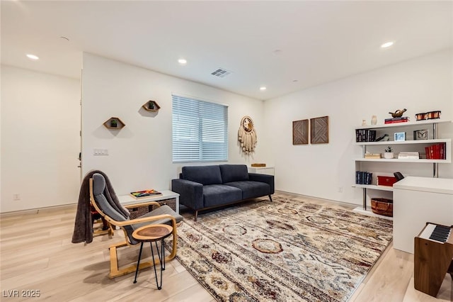 1289 Valencia Cliffs Ave, Henderson, NV 89012 - living room featuring light wood-type flooring and recessed lighting