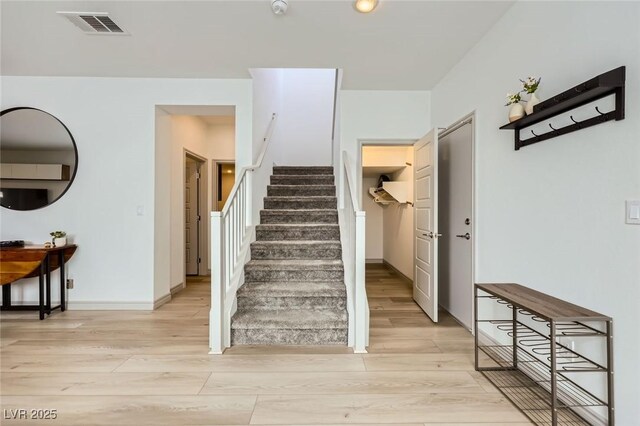 1289 Valencia Cliffs Ave, Henderson, NV 89012 - stairway with wood finished floors and baseboards
