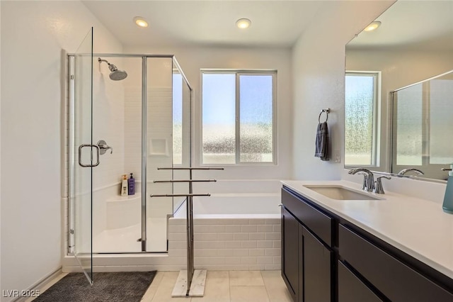 1289 Valencia Cliffs Ave, Henderson, NV 89012 - full bath with a garden tub, a stall shower, vanity, tile patterned flooring, and recessed lighting