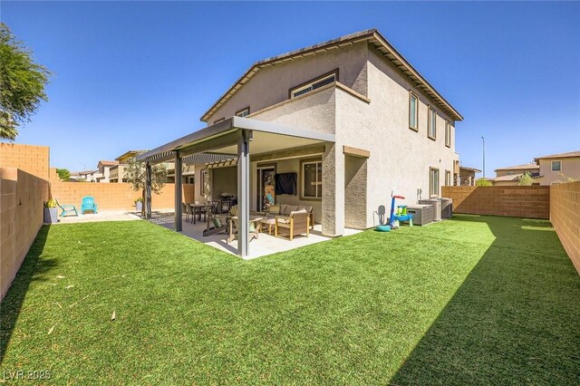 1289 Valencia Cliffs Ave, Henderson, NV 89012 - rear view of house with an outdoor hangout area, a fenced backyard, stucco siding, and a patio area