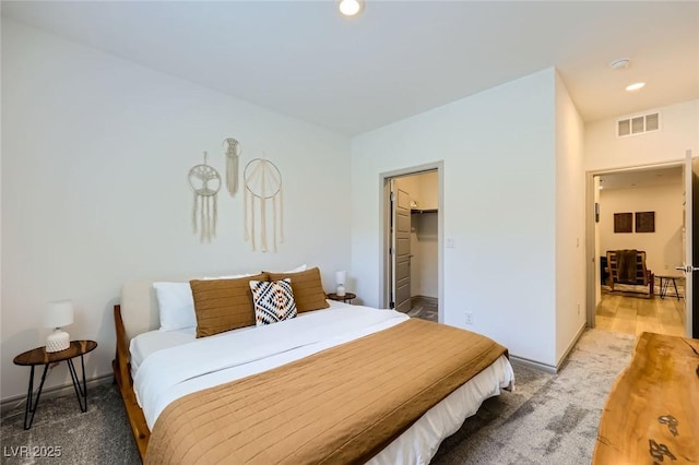 1289 Valencia Cliffs Ave, Henderson, NV 89012 - bedroom with light carpet, recessed lighting, and a spacious closet