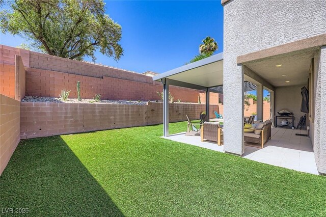 1289 Valencia Cliffs Ave, Henderson, NV 89012 - fenced backyard featuring a patio area and an outdoor hangout area