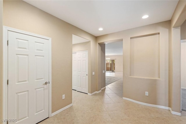 4117 Gliding Gulls Ave, North Las Vegas, NV 89084 - hallway with light tile patterned floors and recessed lighting