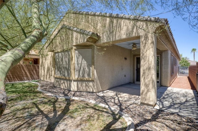 4117 Gliding Gulls Ave, North Las Vegas, NV 89084 - view of side of home with stucco siding and a patio area