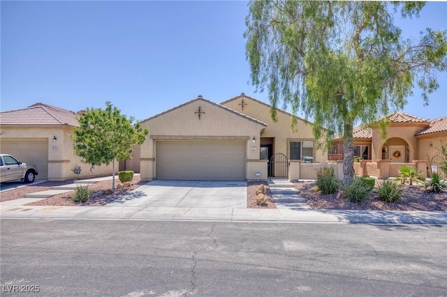 4117 Gliding Gulls Ave, North Las Vegas, NV 89084 - view of front of home with concrete driveway, an attached garage, and stucco siding
