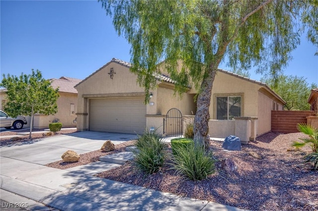 4117 Gliding Gulls Ave, North Las Vegas, NV 89084 - view of front of house with a tile roof, a garage, stucco siding, and driveway