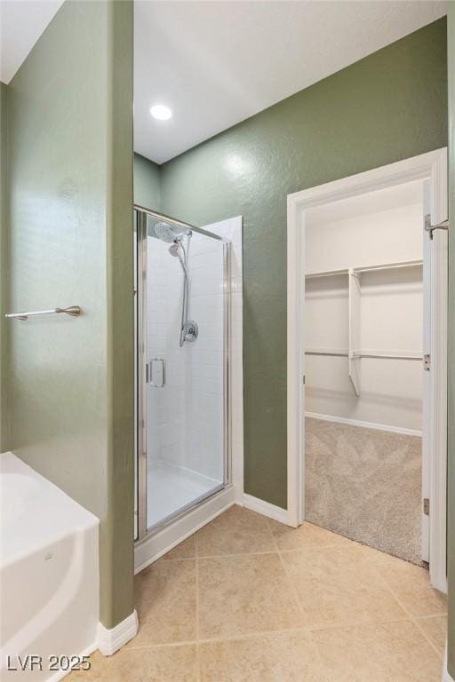 4117 Gliding Gulls Ave, North Las Vegas, NV 89084 - full bath featuring a shower stall, a walk in closet, and tile patterned floors