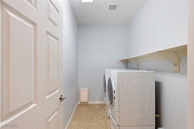 4117 Gliding Gulls Ave, North Las Vegas, NV 89084 - laundry room with washer and dryer and light tile patterned floors
