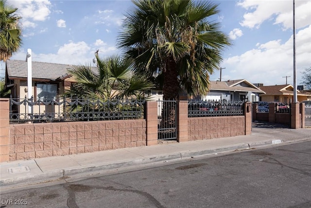 3308 Tabor Ave, North Las Vegas, NV 89030 - view of property hidden behind natural elements with a fenced front yard and a gate