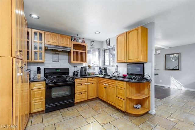 3308 Tabor Ave, North Las Vegas, NV 89030 - kitchen with black gas range oven, open shelves, under cabinet range hood, dark countertops, and recessed lighting