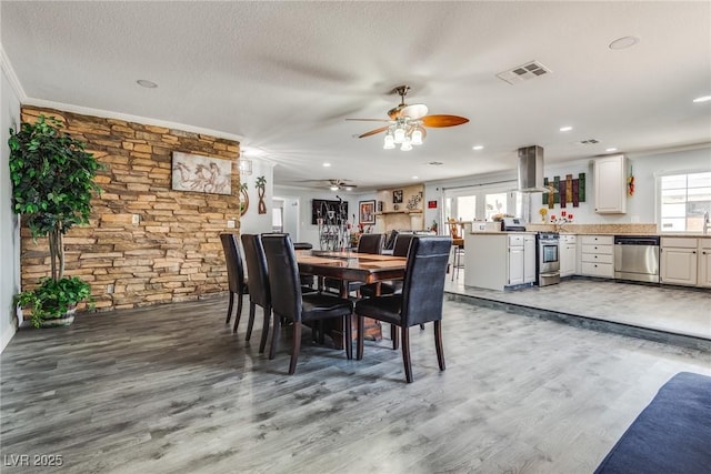 5403 Tamarus St, Las Vegas, NV 89119 - dining room featuring ceiling fan, light wood finished floors, a textured ceiling, recessed lighting, and ornamental molding