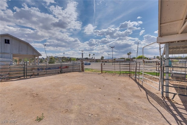 5403 Tamarus St, Las Vegas, NV 89119 - view of yard with an exterior structure, an outdoor structure, and a view of rural / pastoral area