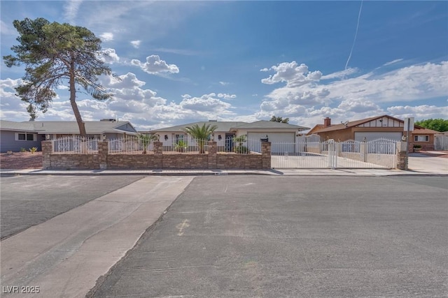 5403 Tamarus St, Las Vegas, NV 89119 - single story home with a fenced front yard, a gate, an attached garage, driveway, and stucco siding