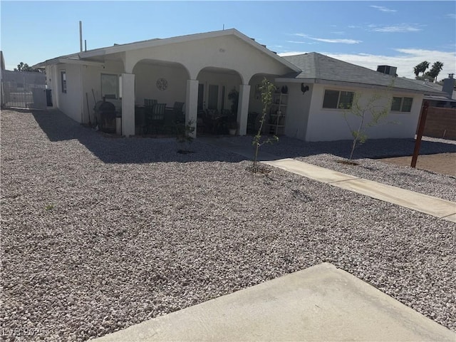 5403 Tamarus St, Las Vegas, NV 89119 - rear view of property featuring stucco siding and a patio