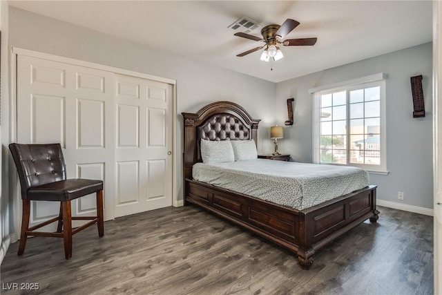 5403 Tamarus St, Las Vegas, NV 89119 - bedroom featuring dark wood-style floors, a closet, and a ceiling fan