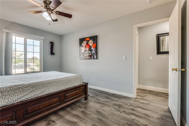 5403 Tamarus St, Las Vegas, NV 89119 - bedroom with dark wood-style flooring and a ceiling fan