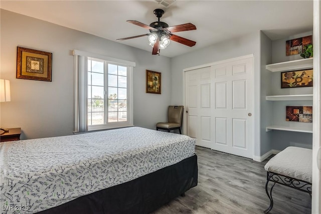 5403 Tamarus St, Las Vegas, NV 89119 - bedroom with wood finished floors, a closet, and ceiling fan