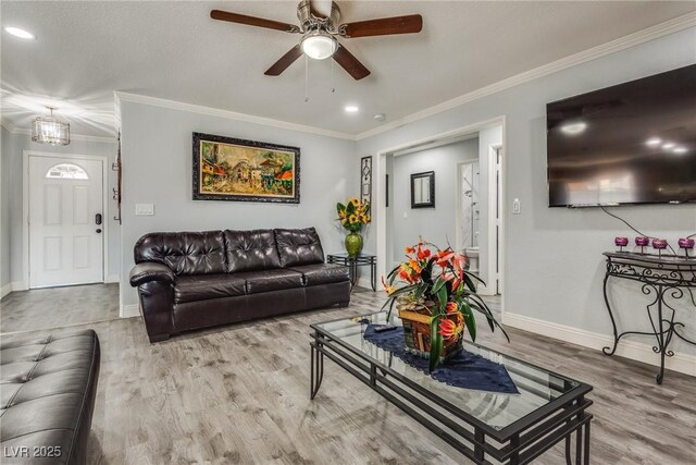 5403 Tamarus St, Las Vegas, NV 89119 - living room featuring wood finished floors, a ceiling fan, ornamental molding, and recessed lighting