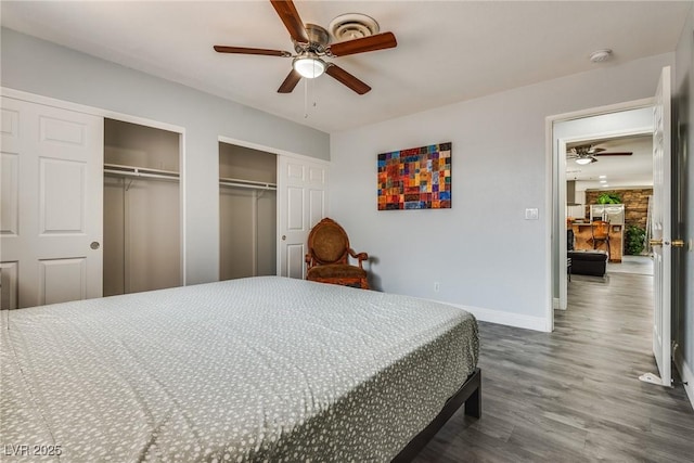 5403 Tamarus St, Las Vegas, NV 89119 - bedroom featuring two closets, dark wood-type flooring, and ceiling fan
