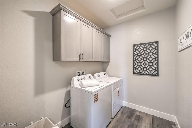1408 Eva Creek Dr Unit 27, North Las Vegas, NV 89084 - washroom featuring washing machine and clothes dryer, cabinet space, attic access, and dark wood-type flooring