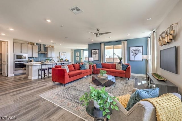 1408 Eva Creek Dr Unit 27, North Las Vegas, NV 89084 - living room featuring recessed lighting, wood finished floors, and ceiling fan