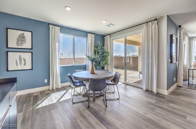 1408 Eva Creek Dr Unit 27, North Las Vegas, NV 89084 - dining area with baseboards and wood finished floors