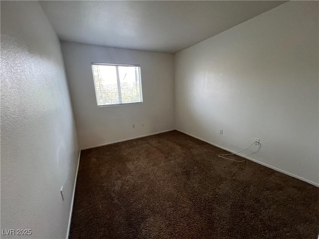 5253 Westwind Rd, Las Vegas, NV 89118 - empty room with dark colored carpet and baseboards