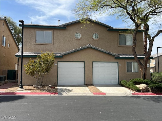 5253 Westwind Rd, Las Vegas, NV 89118 - view of property with stucco siding, driveway, and a garage
