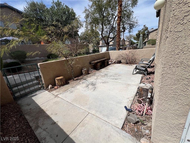 5253 Westwind Rd, Las Vegas, NV 89118 - view of patio / terrace featuring a gate and a residential view