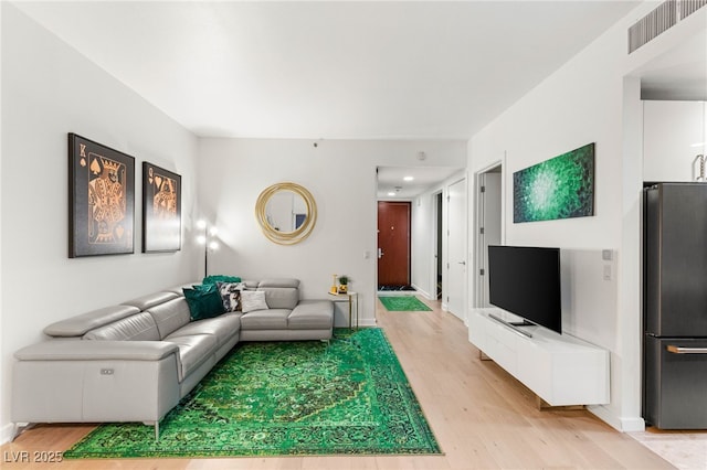 4525 Dean Martin Dr Unit 1007, Las Vegas, NV 89103 - living area with light wood-style floors