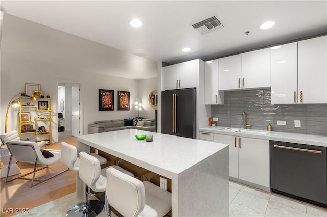 4525 Dean Martin Dr Unit 1007, Las Vegas, NV 89103 - kitchen with dishwashing machine, high quality fridge, open floor plan, light countertops, and recessed lighting
