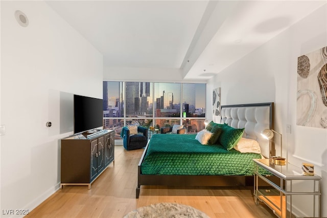 4525 Dean Martin Dr Unit 1007, Las Vegas, NV 89103 - bedroom featuring wood finished floors and baseboards