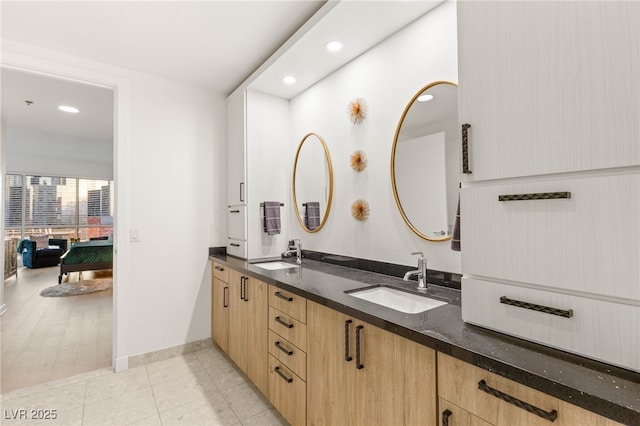 4525 Dean Martin Dr Unit 1007, Las Vegas, NV 89103 - full bath with double vanity, recessed lighting, and tile patterned floors