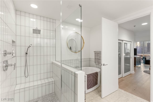 4525 Dean Martin Dr Unit 1007, Las Vegas, NV 89103 - full bathroom featuring tiled shower, a soaking tub, tile patterned floors, and recessed lighting
