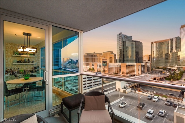 4525 Dean Martin Dr Unit 1007, Las Vegas, NV 89103 - balcony at dusk featuring a city view