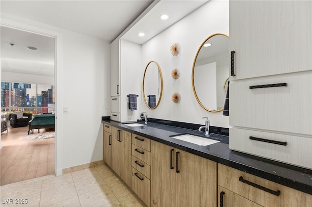 4525 Dean Martin Dr Unit 1007, Las Vegas, NV 89103 - bathroom with double vanity, recessed lighting, and tile patterned floors