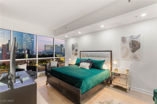 4525 Dean Martin Dr Unit 1007, Las Vegas, NV 89103 - bedroom featuring wood finished floors, recessed lighting, and a view of city