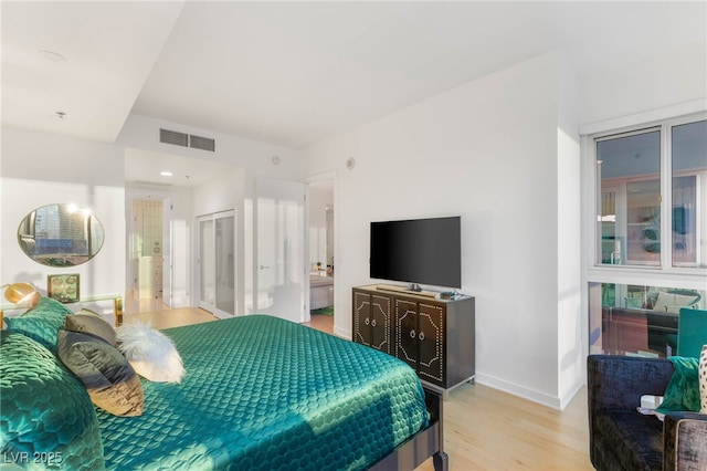 4525 Dean Martin Dr Unit 1007, Las Vegas, NV 89103 - bedroom featuring light wood finished floors and baseboards