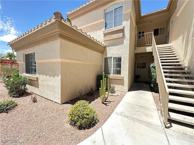 7400 W Flamingo Rd Unit 1094, Las Vegas, NV 89147 - entrance to property with stucco siding and a tile roof