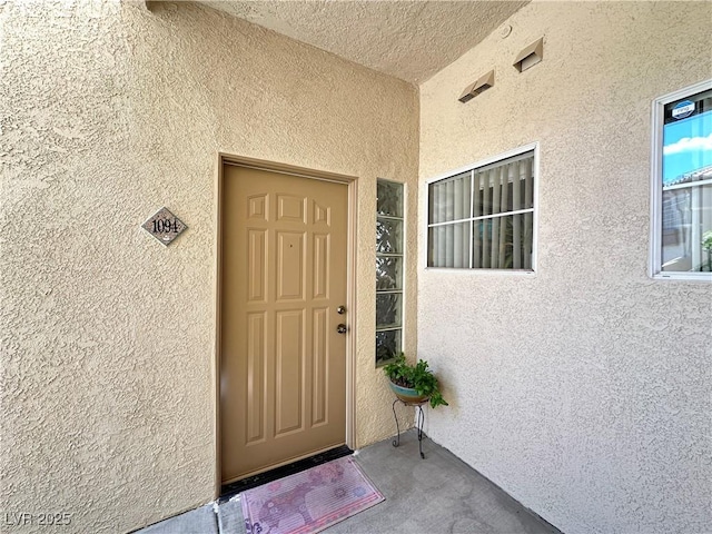 7400 W Flamingo Rd Unit 1094, Las Vegas, NV 89147 - doorway to property featuring stucco siding